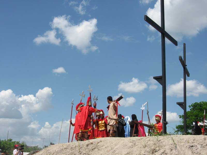 The start of the most realistic passion play where the participants are voluntarily nailed to the cross.